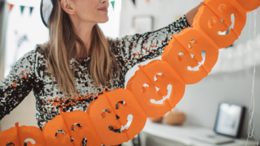 Woman decorating for halloween