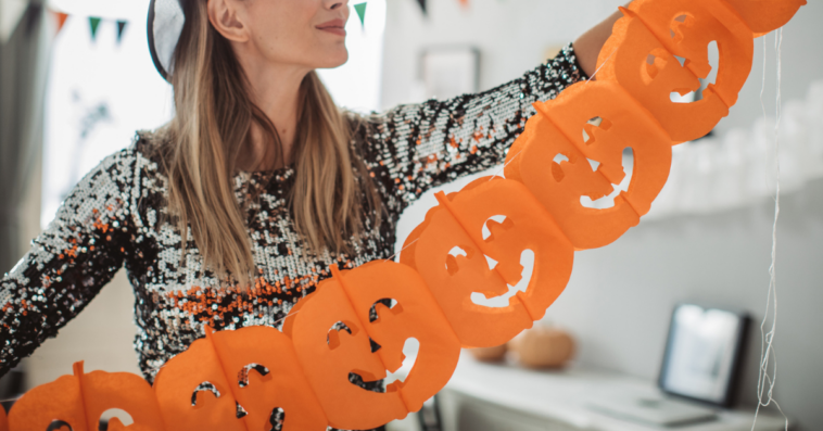 Woman decorating for halloween