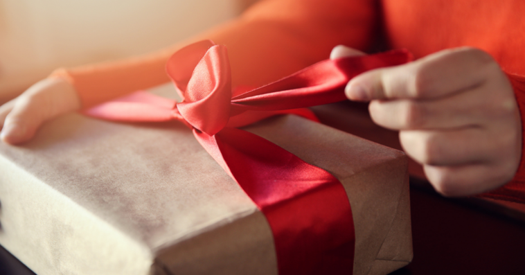 Woman opening a gift