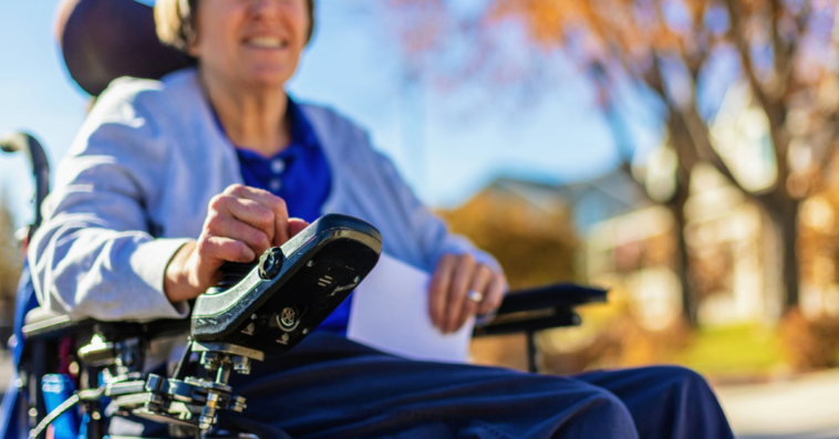 woman in motorized wheelchair
