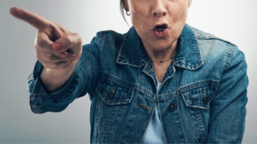 angry older woman pointing her finger while speaking