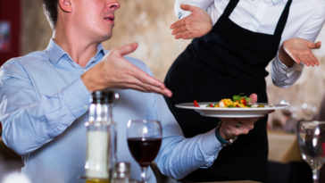 Man berating a restaurant server