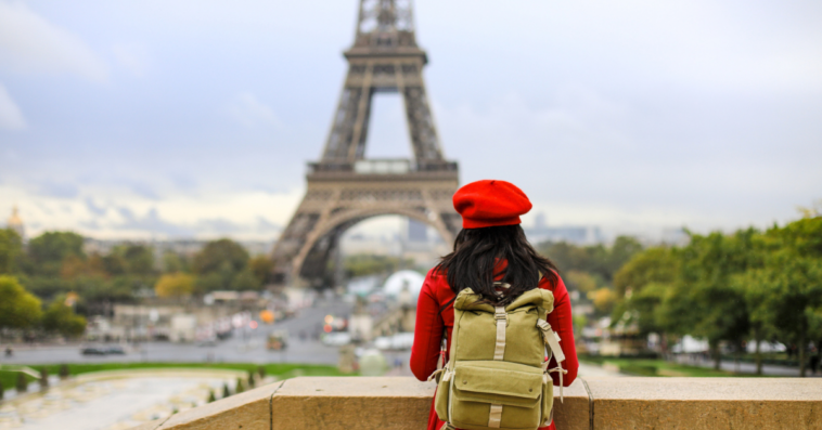 Woman looking at the Eiffel Tower.