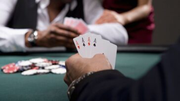 Man with four aces in casino