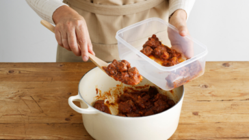 Woman packing leftovers