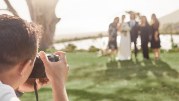 Wedding photographer taking family portrait