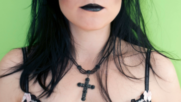 Woman wearing goth attire and makeup