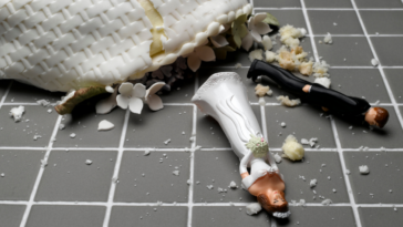 Wedding cake fallen to the ground and smashed.