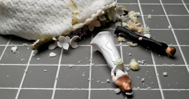 Wedding cake fallen to the ground and smashed.