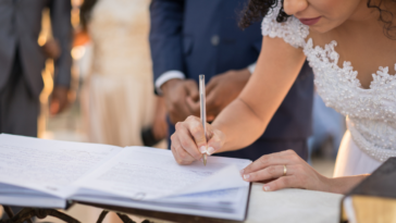 bride signing her wedding license