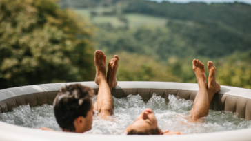 A couple in an outdoor hot tub.