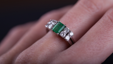 Woman wearing an emerald green ring