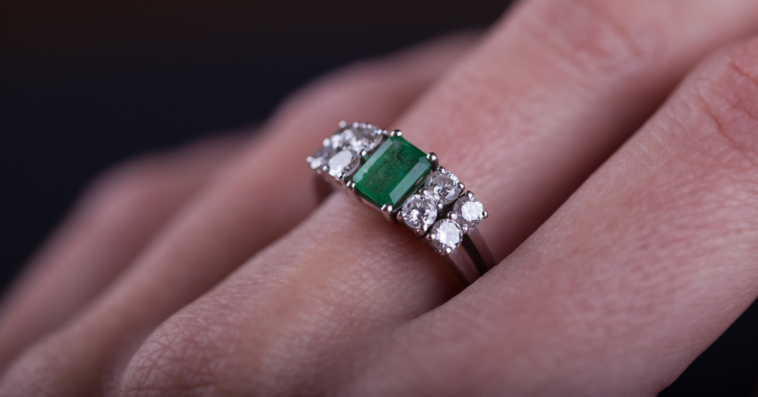 Woman wearing an emerald green ring