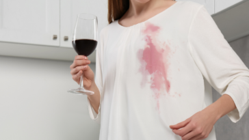 Woman with a wine stain on an expensive dress