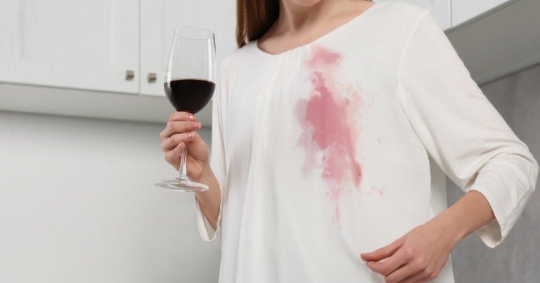 Woman with a wine stain on an expensive dress