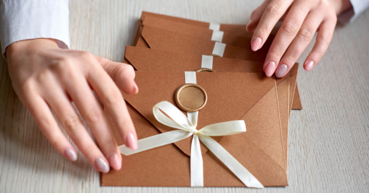 woman with wedding invitations