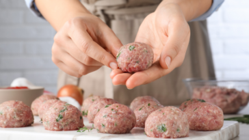 person making meatballs