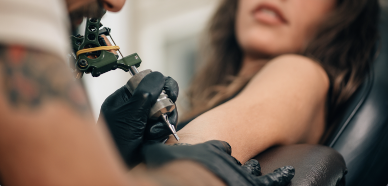 A woman getting a tattoo.