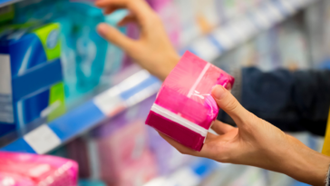 Person shopping for feminine hygiene products
