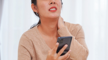 exasperated woman looking at cellphone