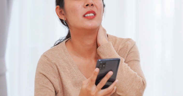 exasperated woman looking at cellphone