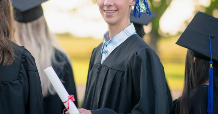 teenage boy at his high school graduation