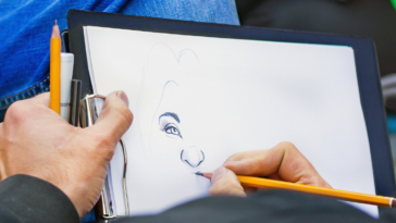 artist sketching caricature of woman