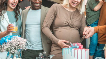 Cake being cut at a gender reveal party