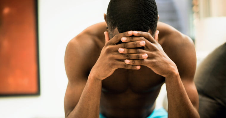 upset man with head in his hands