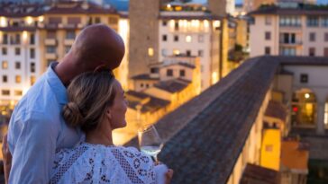 Couple enjoying a beautiful view of Florence at dusk.