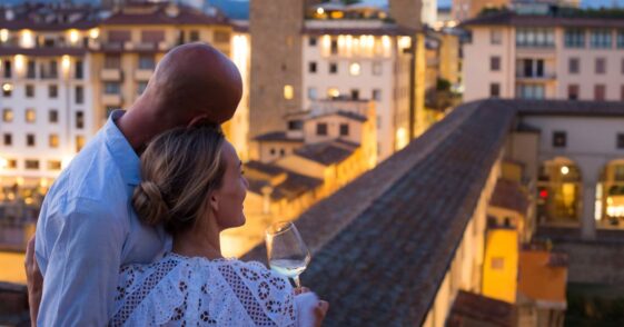 Couple enjoying a beautiful view of Florence at dusk.