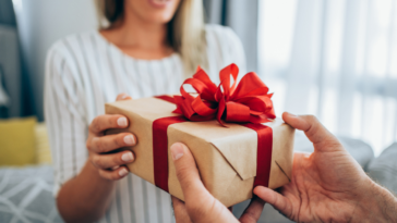 A woman receiving a present.