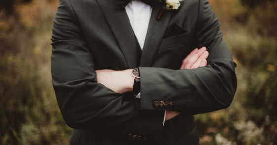 Groom with his arms crossed
