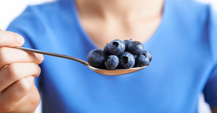 woman with blueberries