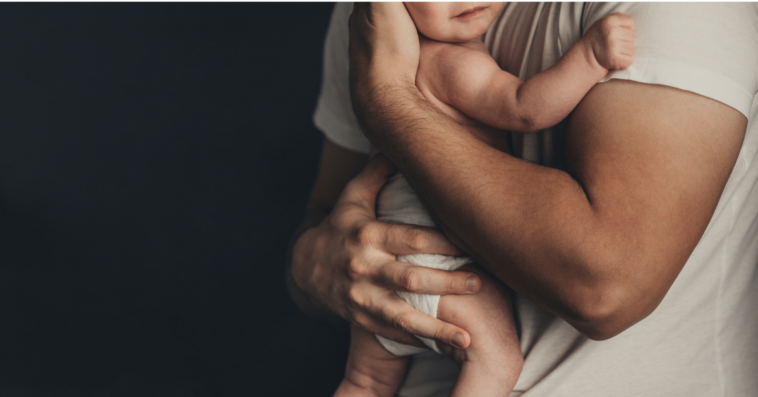 Father holding baby boy