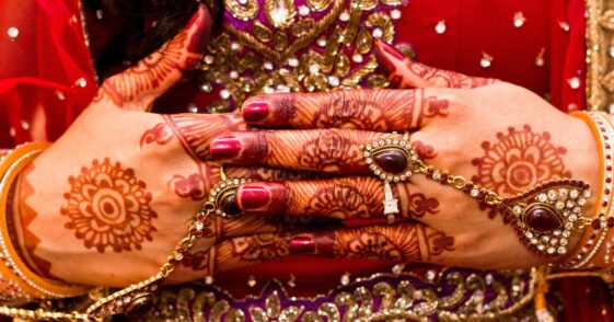 Close up of mehndi on a woman's hand.