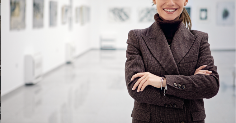 A woman standing in an art gallery.