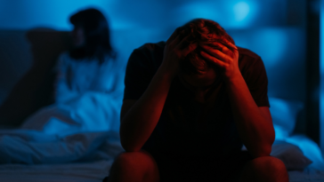 Couple arguing in bed