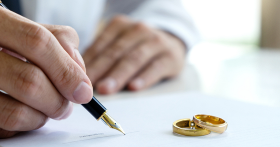 Person signing a prenuptial agreement