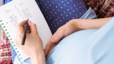 pregnant woman listing baby names