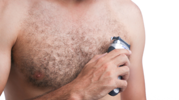 Man shaving chest