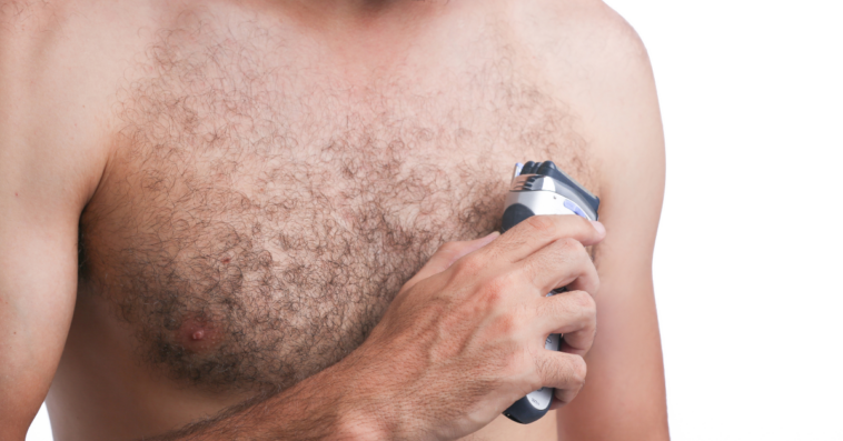 Man shaving chest