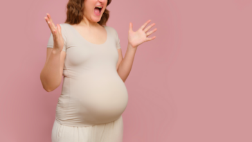 A pregnant woman screaming.