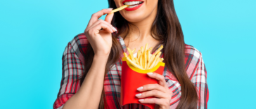 Woman eating french fries