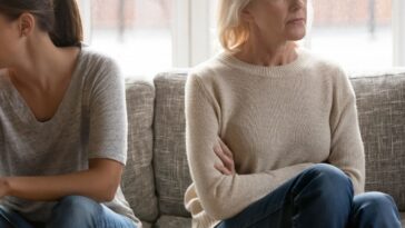 Two women ignoring each other
