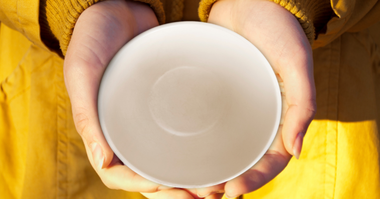 Girl holding an empty dish.