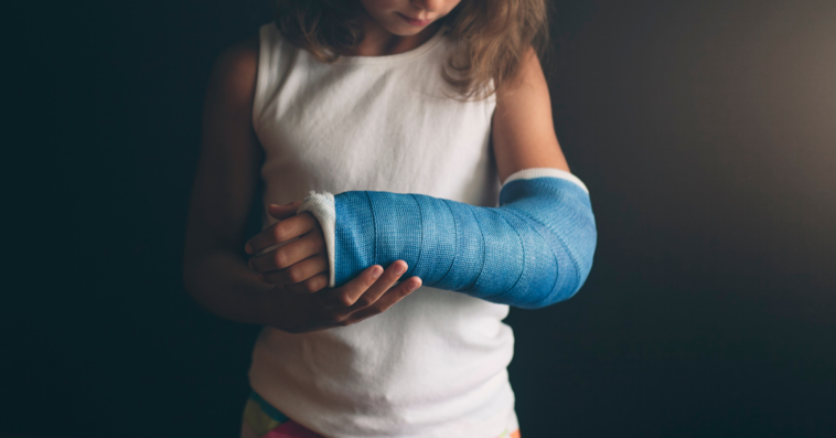 Young girl with cast on arm