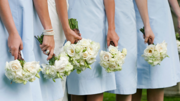 A line of bridesmaids holding bouquets