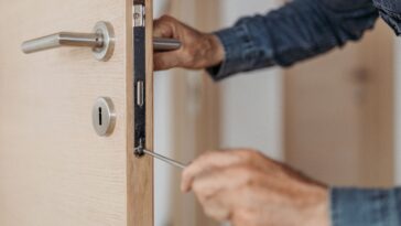 Man fixing a door lock