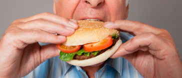 man eating a burger